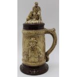 A 20th century glazed pottery Bierstein, moulded hunting scene decoration with antler form handle,