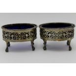 A pair of George III silver salts, oval form with beaded rims, pierced galleries, raised on tall