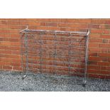 An early 20th century galvanized frame wine cellar rack, 125cm x 128cm