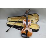 A modern Korean made copy of a Stradivarius violin by Nyojeong having 14 inch two piece back, housed