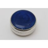 A circular silver pill box, the cover with blue guilloche enamel panel, 5.5cm diameter, gross 59g