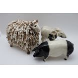 A Raku pottery horned sheep, 13cm high, a studio pottery long fleece sheep and a 'Coopercraft'