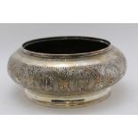 A Malaysian white metal bowl, chased decoration includes the arms of various cities, including