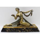 After Jacques Limousin, a French Art Deco gilded spelter dancing girl, raised upon a marble base,
