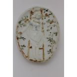 A late 19th century pottery Naughty Nineties oval dish, on the front a young woman is on a ladder