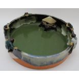 A late 19th century Japanese Sumida Gowa bowl, moulded with five glazed figures peering over the