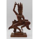 A 20th century carved wood Cambodian dancer on plinth base, 33.5cm high, inset seal mark to base '