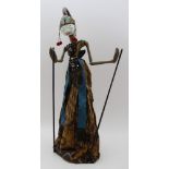 An Indonesian Wayang Golek (rod puppet), painted & gilded softwood and fabric construction,