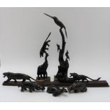 A collection of seven African carved & polished horn animals, to include; lions, rhino, hippo,