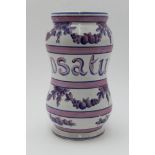 A 19th century French glazed terracotta albarello, pink & blue painted decoration of flowers & fruit