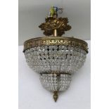 A brass mounted glass ceiling chandelier, 25cm in diameter, with decorative rose