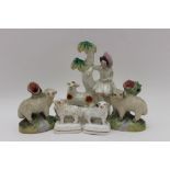 A collection of 19th century Staffordshire pottery items, includes a pair of lamb spill vases,