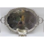A silver plated two handled tea tray, with cast & engraved decoration, 63.5cm overall, together with