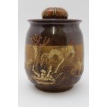 A 20th century Royal Doulton tobacco jar with applied hunting scene, the lid having acorn and oak