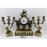 A late 19th century French clock garniture, alabaster and gilt metal, putti decorated, the clock