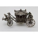 Toye, Kenning & Spencer, a cast silver model of the British Coronation Carriage, made to commemorate