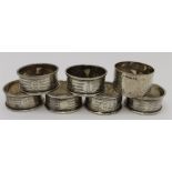 Samuel M. Levi, A set of six silver napkin rings, Birmingham 1922, together with a chased silver