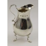 Barker Brothers, a Georgian design silver cream jug of baluster, scroll