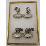 A boxed set of four siam sterling silver dining menu / place holders, two