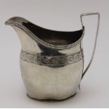 Thomas Wallis, A George III silver cream jug, chased leaf band decoration, London 1801, 93g