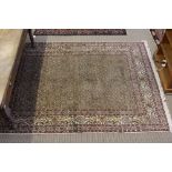 A woven woollen geometric patterned Moud carpet on pale ground 280cm x 200cm