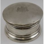 An early 20th century silver powder box, the hinged lid contains a mirror, Birmingham 1919, 9cm in