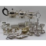 A quantity of silver plated wares, to include; a three-piece tea set, table bell, tea strainer,