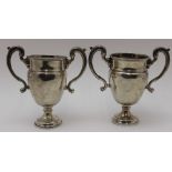 F.C. Richards, A pair of silver two-handled trophy form vases on circular raised bases, same maker