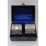 John Edward Wilmot, A pair of late Victorian silver napkin rings, chased canthus leaf decoration,