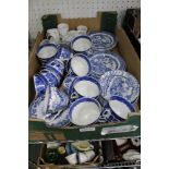 A box containing a selection of domestic blue-and-white transfer decorated tea wares