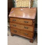 A well-made mahogany bodied bureau of typical form construction with decorative cross banding,