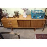 An Avallon retro teak finished long and low sideboard