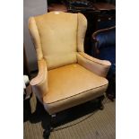 An old gold velour upholstered small proportioned Georgian design wingback armchair