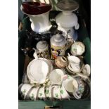A box containing a selection of domestic pottery to include cow creamers and a modern glass dish