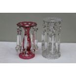 Two Victorian lustres, one cranberry flashed, the other of cut plain glass, the tallest 23cm