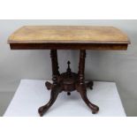 A Victorian walnut centre table having pollard would cross banded top, supported on four turned upri