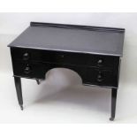 An ebonised desk with single draw over two smaller draws with knee hole on four plane legs 76 x 106