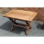 A Wareing and Gillow oak draw leaf tavern style dining table