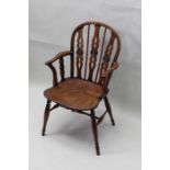 19th century stick and slat back country armchair with carved bull's-eye roundels with well figured