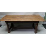 A refectory style possibly part 18th century dining table on four round and block legs with a "H" s