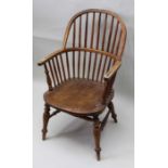 A hoop & stick back armchair having well figured solid seat supported on four splayed legs united by