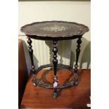A 20th century imitation lacquer work and painted occasional table, with oval pie crust edge and cen