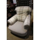 A re-upholstered first quarter 20th century club arm chair