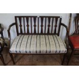 A two seater upholstered bench