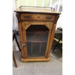 An Edwardian marquetry inlaid music cabinet, fitted single glazed door, 55cm wide