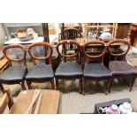 A set of five Victorian balloon backed chairs with fancy turned fore legs