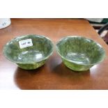 A pair of Chinese spinach green jade bowls, 12cm in diameter