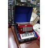 A cased Bell 32 key accordion with 3 selectable voices with doc's
