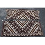 Two 20th century Navajo flat weave rugs / saddle blankets, geometric design in browns and cream