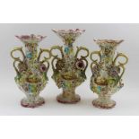 A garniture set of three Victorian Colebrookdale type ceramic vases